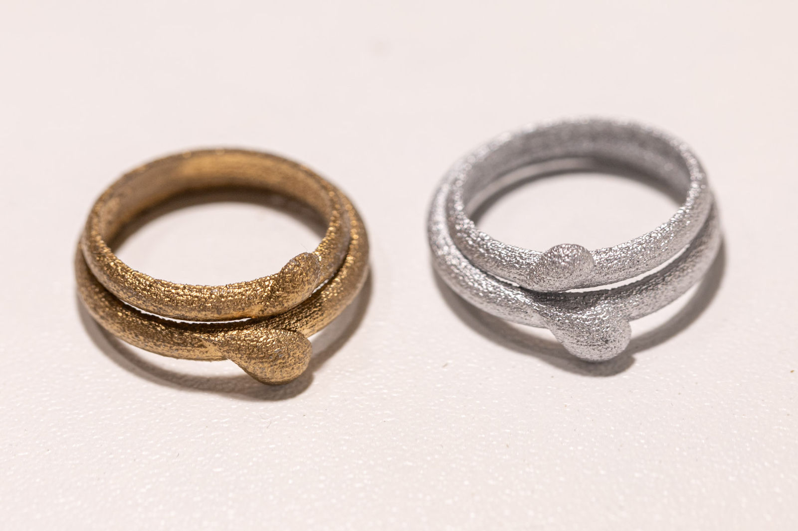 Photograph of two Sweet Heart rings in gold and silver metallized cast nylon, Nobahar Design