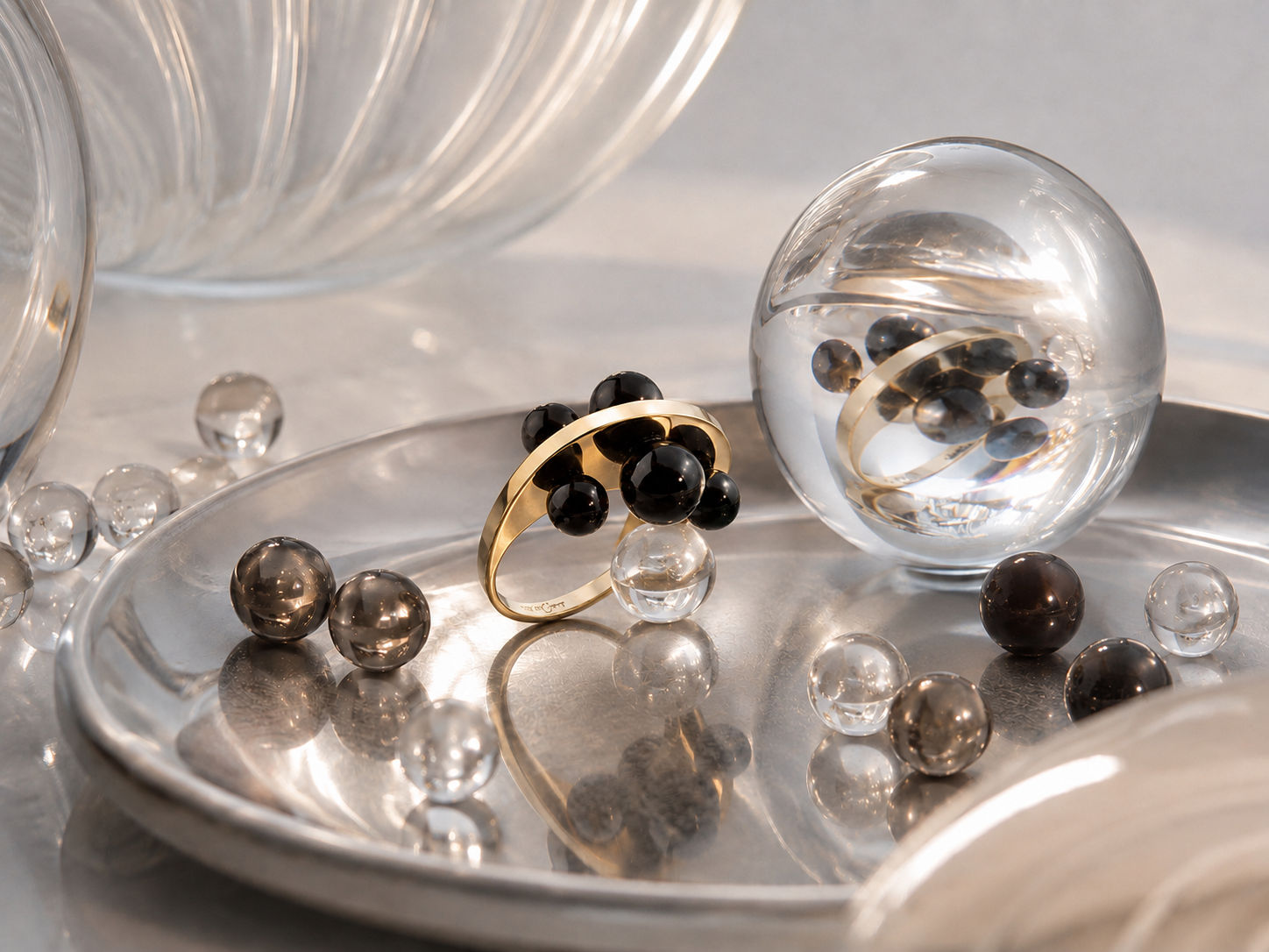CGI render of the Maymoma Contrarié Sphere Ring on a silver tray with glass spheres, modelled from photographs by Sogand Nobahar horizontal