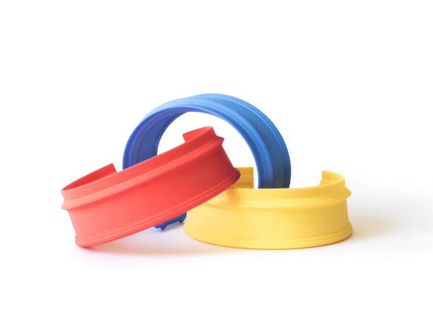 Three MyCity Tehran bracelets in red, blue and yellow, physical pieces by Nobahar Design