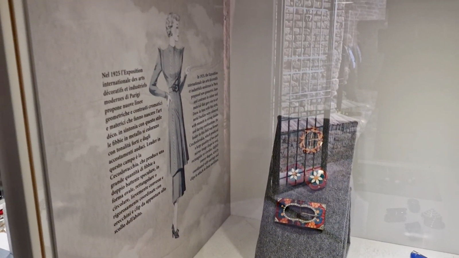Art Deco buckles on a felt wedge beside a 1925 exhibition panel, Milleuna Fibbia display design by Sogand Nobahar