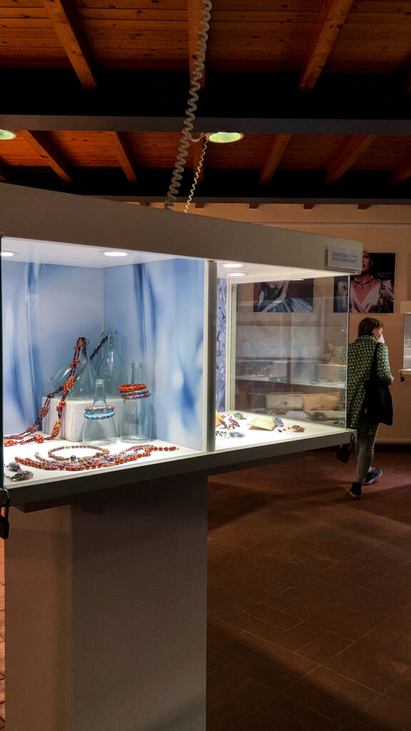 Visitor viewing the Vetro exhibition vitrines, display design by Sogand Nobahar