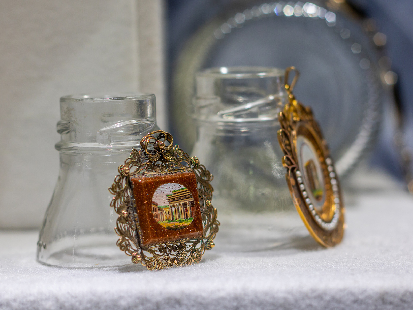 Murano micromosaic pendants displayed on cut glass supports, Museo del Bijou display design by Sogand Nobahar